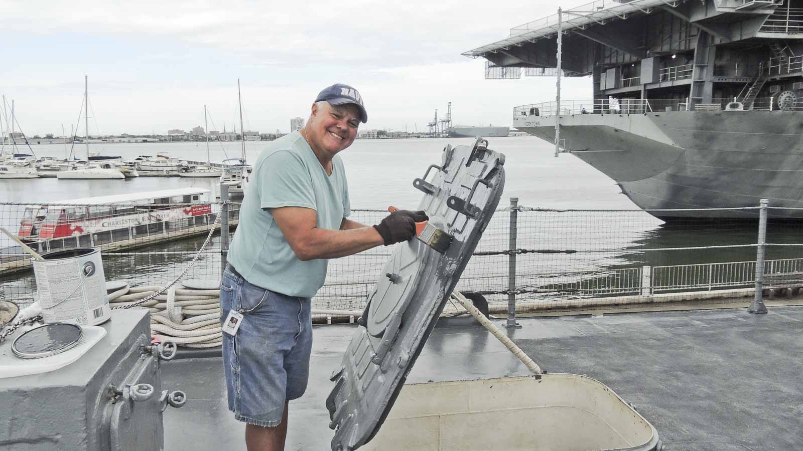 Man Painting The Equipment - Patriots Point Foundation